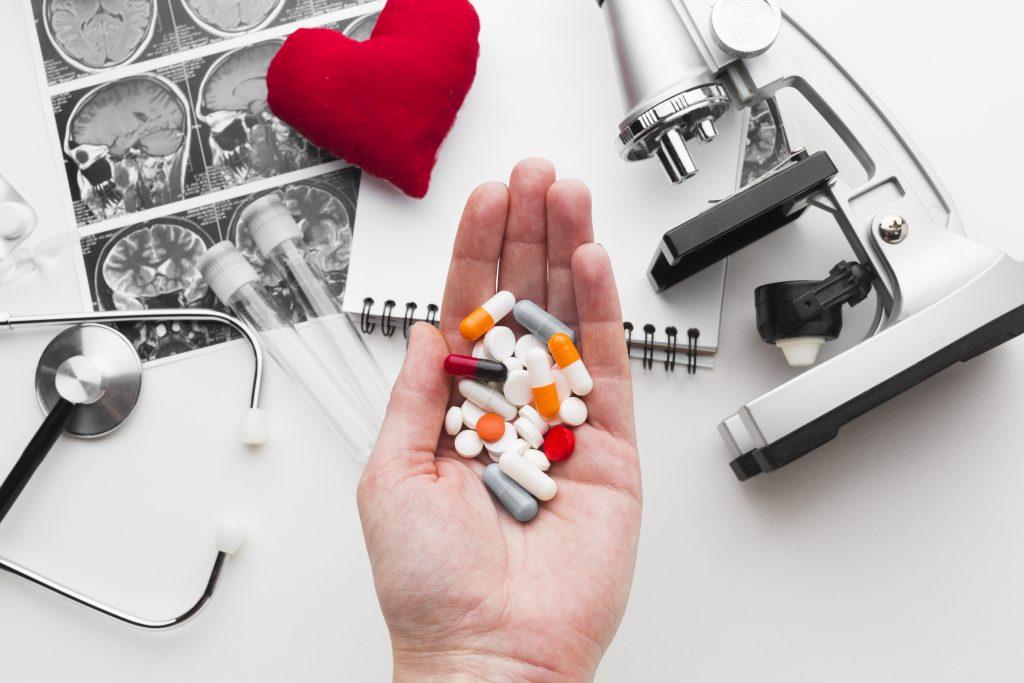 black-white-medical-tools-hand-with-pills